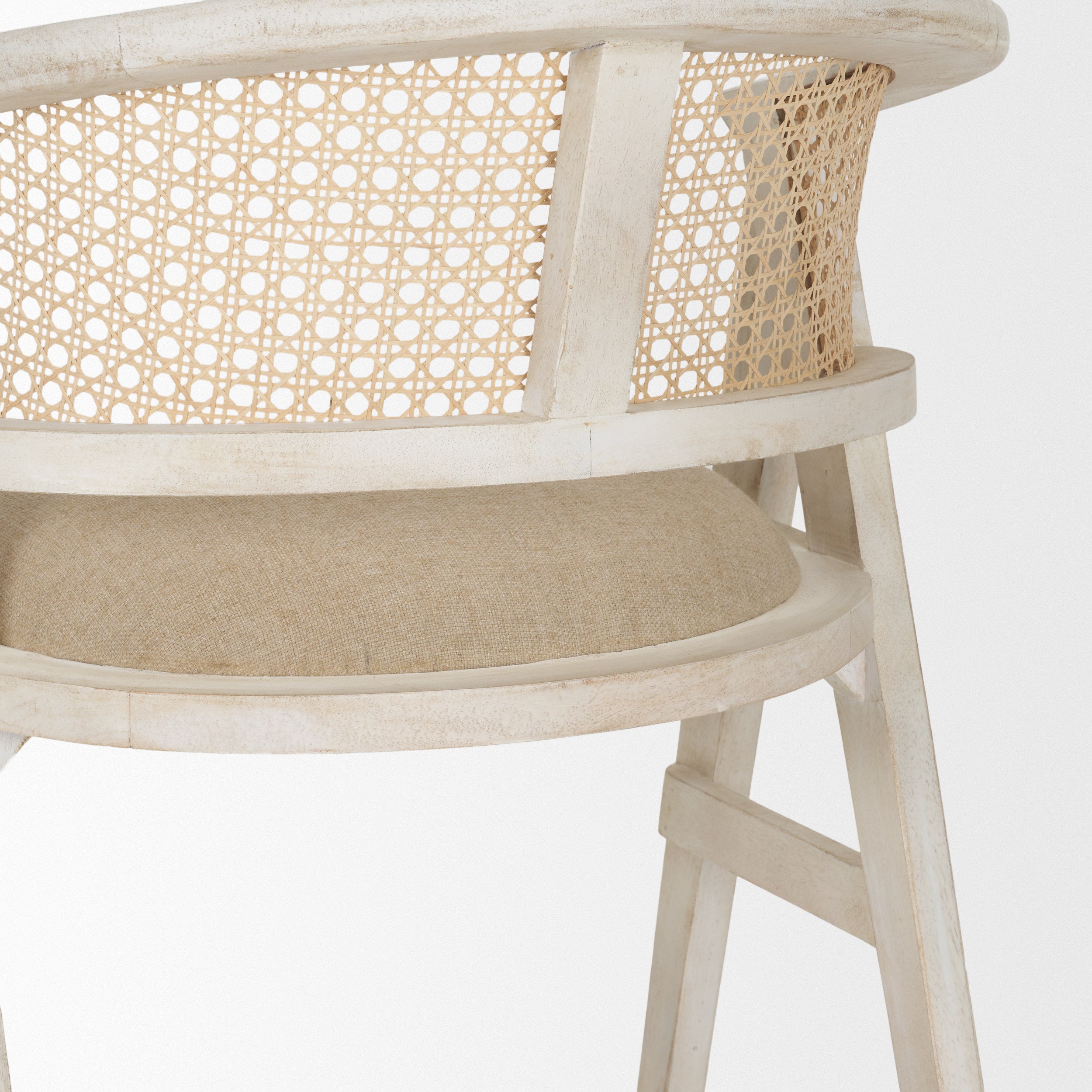 blonde Indian mango wood frame, triangular leg design, a curved cane back, and a padded natural linen seat.