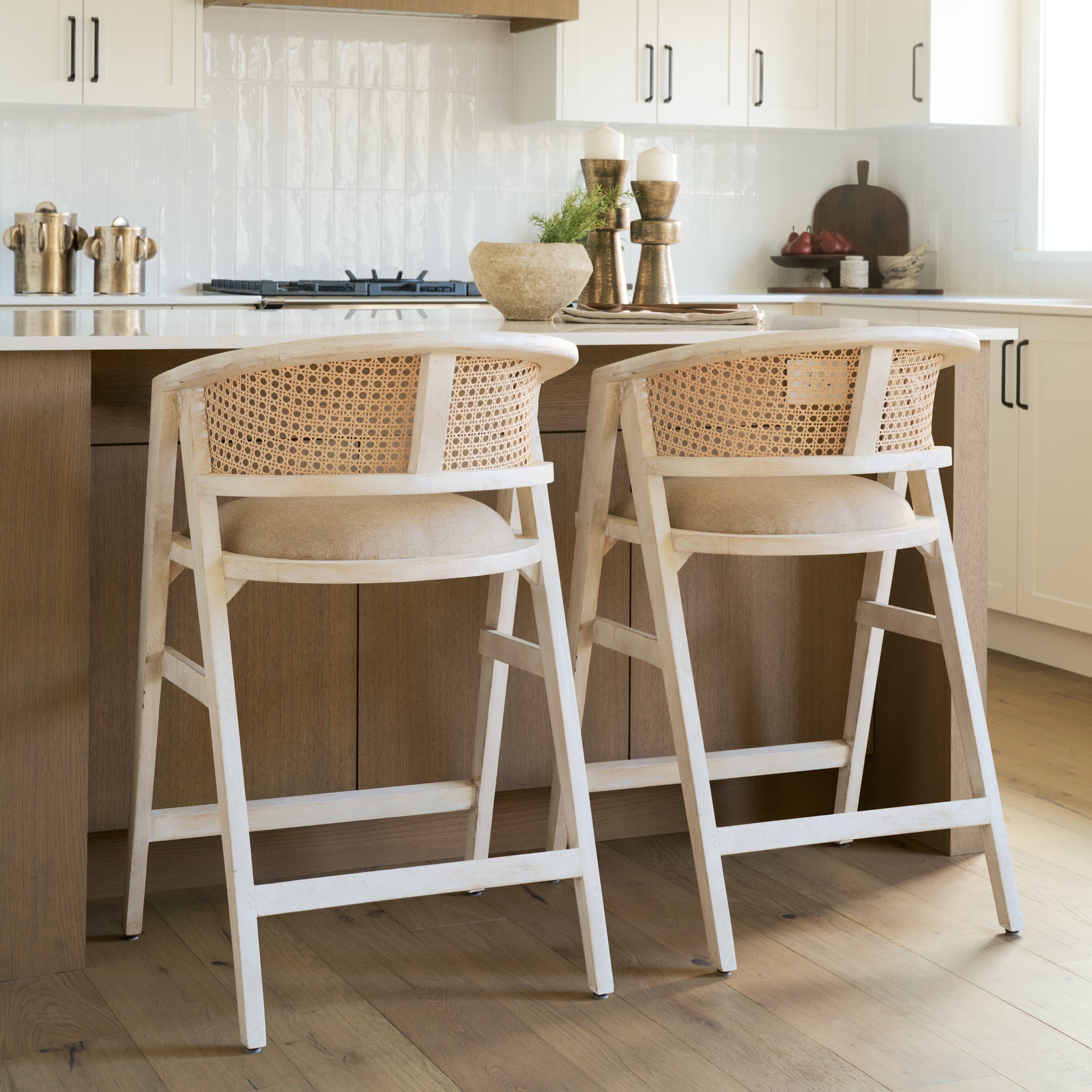 blonde Indian mango wood frame, triangular leg design, a curved cane back, and a padded natural linen seat.