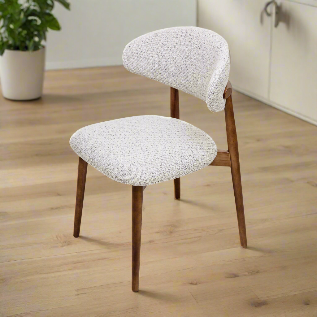 Cammy dining chair with beige textured fabric upholstery and walnut wood legs, front view on white background
