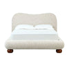 Front view of the Afra upholstered bed featuring a soft cream chenille fabric and a modern wave-shaped rounded headboard