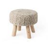 Front three-quarter view of the Bina accent stool featuring a thick gray knitted wool seat and four natural wood legs