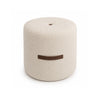 Front view of the Cushy cylindrical ottoman featuring cream bouclé upholstery and a decorative brown leather-style horizontal handle