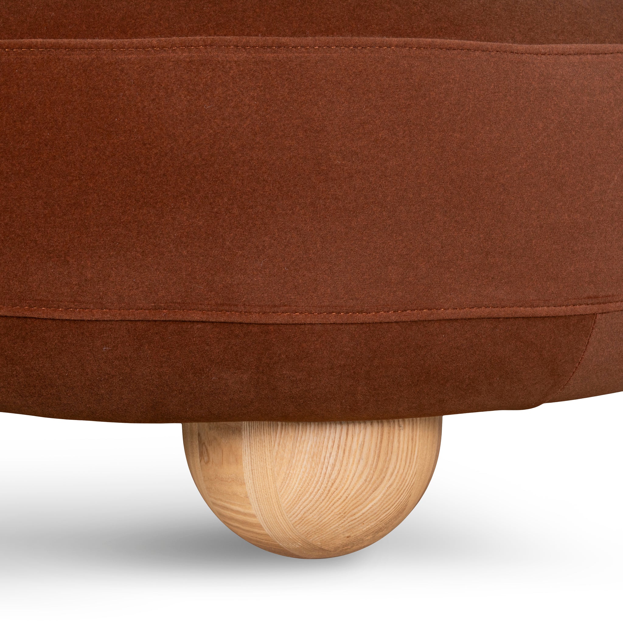 Ebba sofa in textured cream fabric with rounded arms and decorative circular pillows