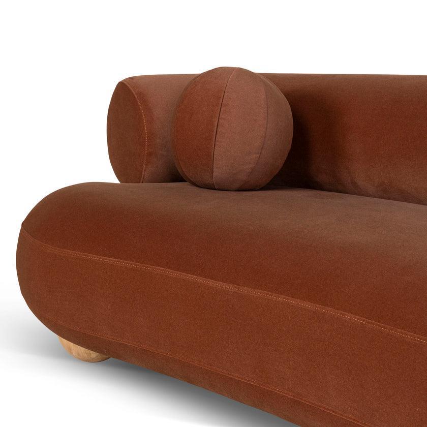 Ebba sofa in textured cream fabric with rounded arms and decorative circular pillows