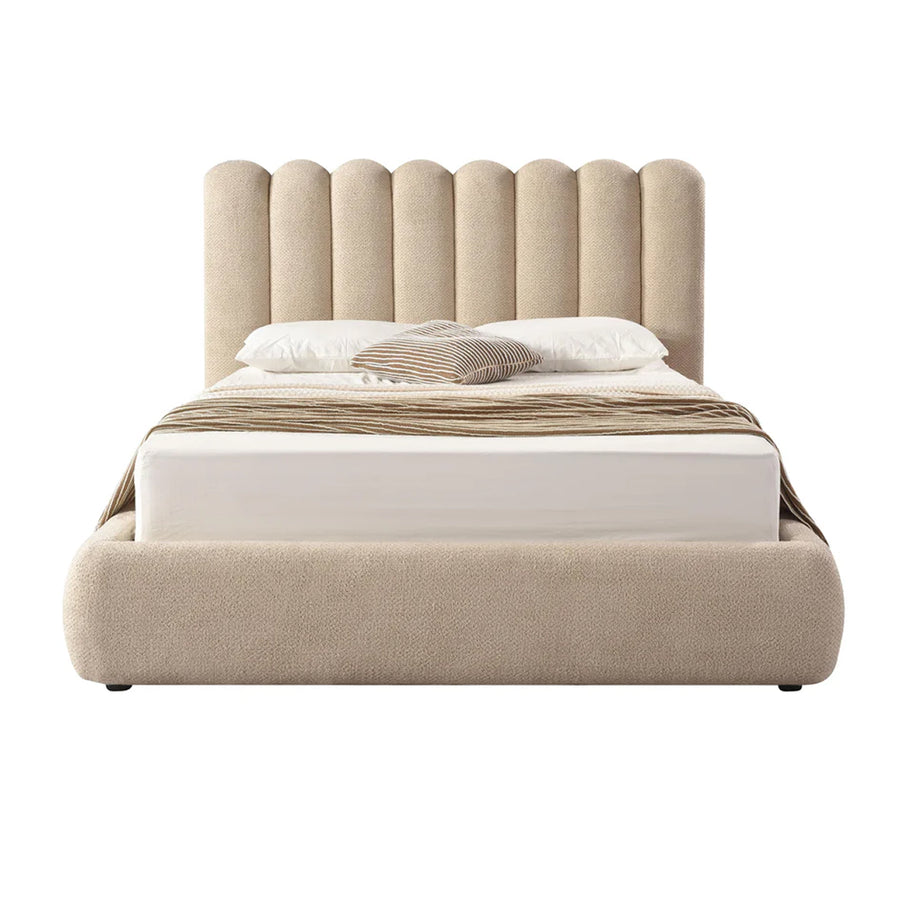Front view of the Eira upholstered storage bed featuring a cream bouclé finish and a unique curved scalloped headboard