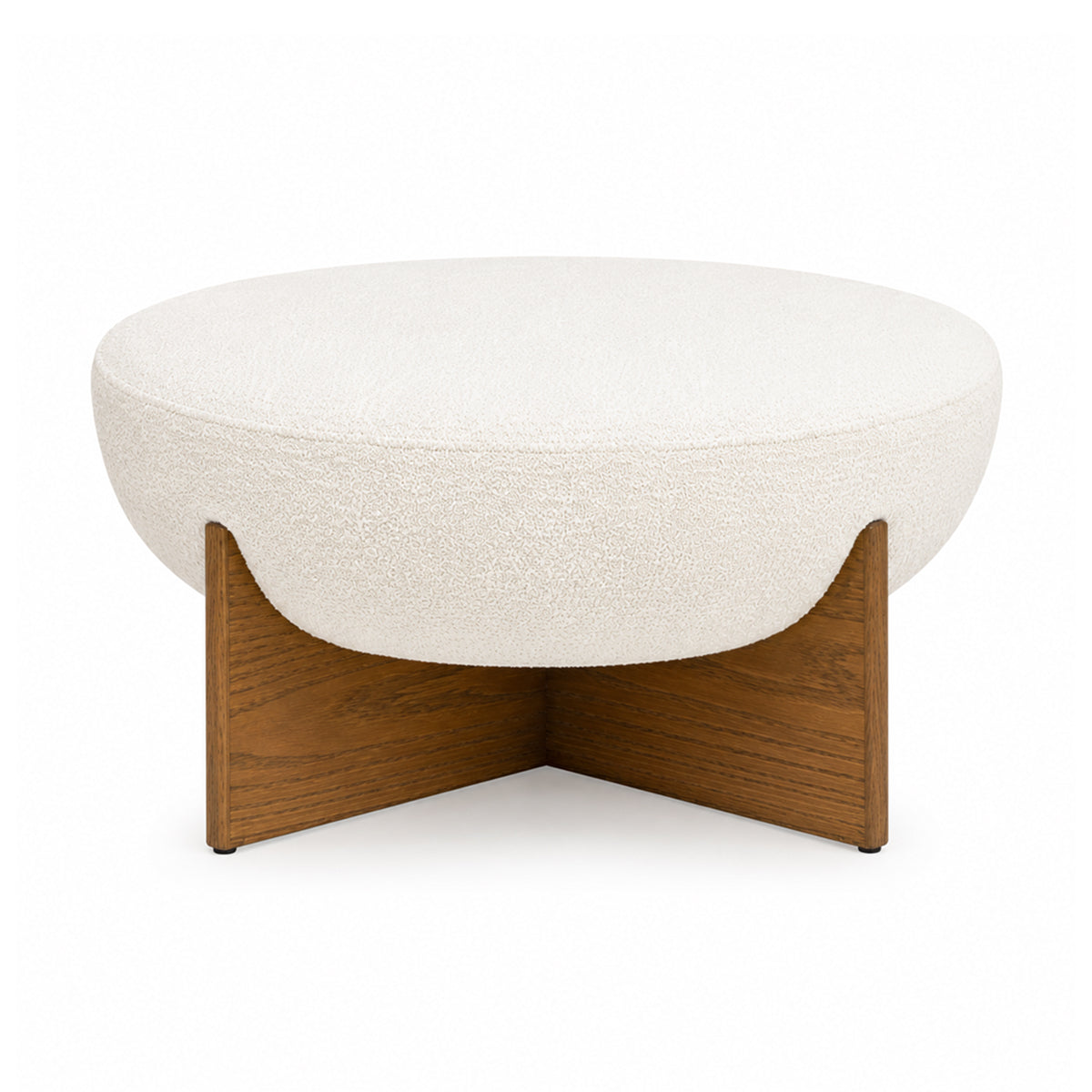 Front view of the Elara ottoman featuring a white bouclé bowl-shaped seat and a natural wood cross-base frame
