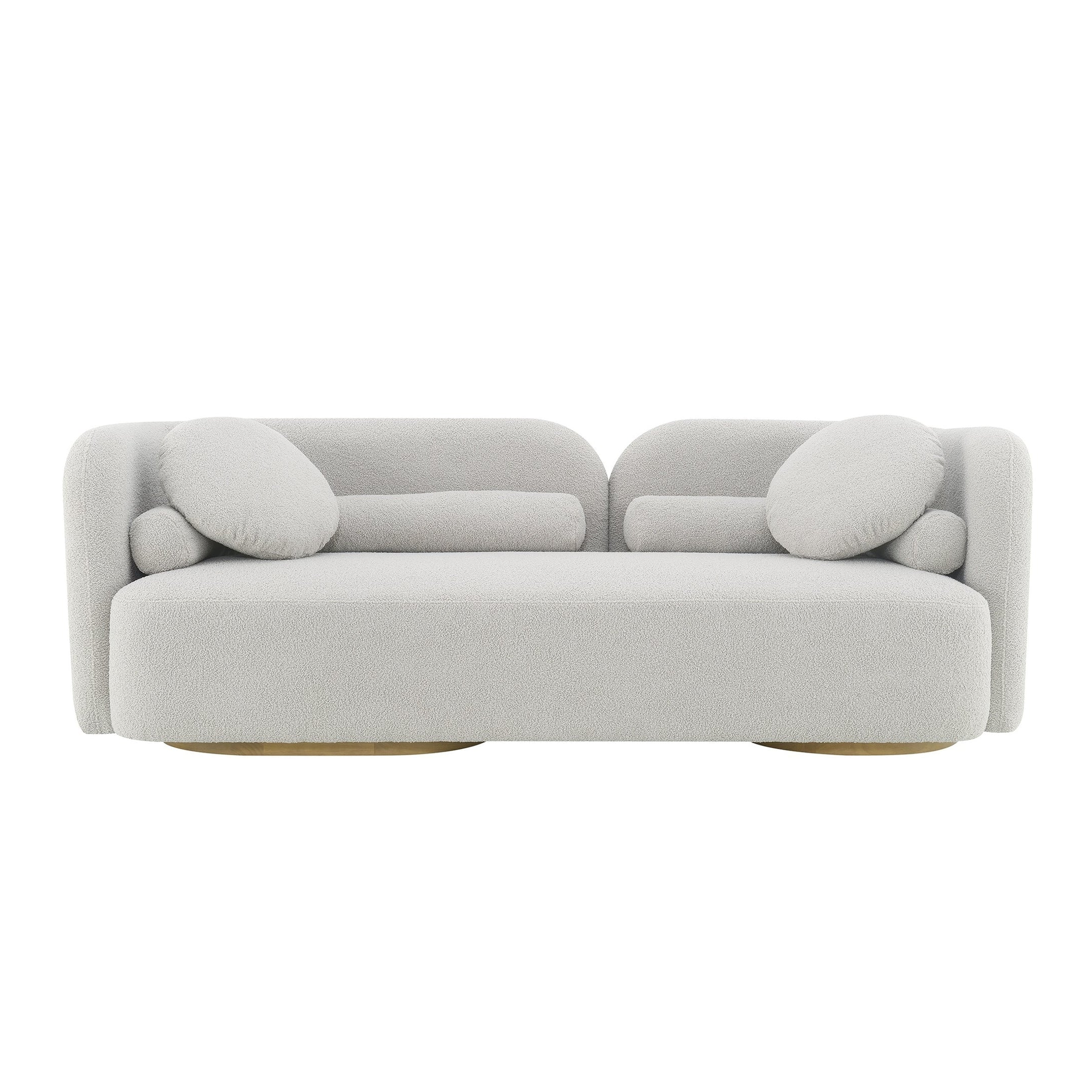 A modern light gray upholstered sofa with rounded block arms, matching round back cushions, and a low wooden base, shown against a plain white background.