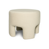 Front three-quarter view of the Ginger mushroom-shaped ottoman featuring plush natural velvet upholstery