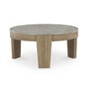 Front view of the Guystone round coffee table featuring a grey concrete-style top and a light natural wood frame with tapered legs
