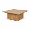 Front perspective view of the June square coffee table featuring a natural wood finish and a thick fluted pedestal base