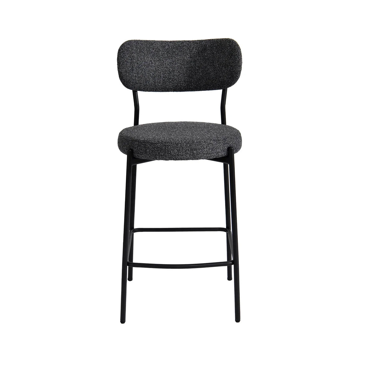 A modern bar stool with a textured dark gray fabric seat and backrest, supported by a slim black metal frame with a footrest.