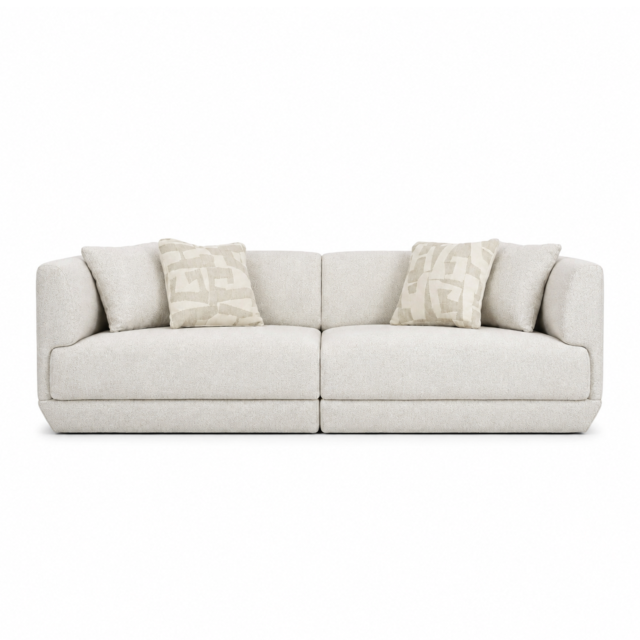 A modern sofa upholstered in a light beige textured fabric, styled with two decorative throw pillows featuring a geometric pattern, set against a plain white background.
