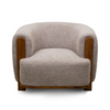Front view of the Keji Armchair in pebble grey bouclé featuring a rounded silhouette and integrated natural wood frame