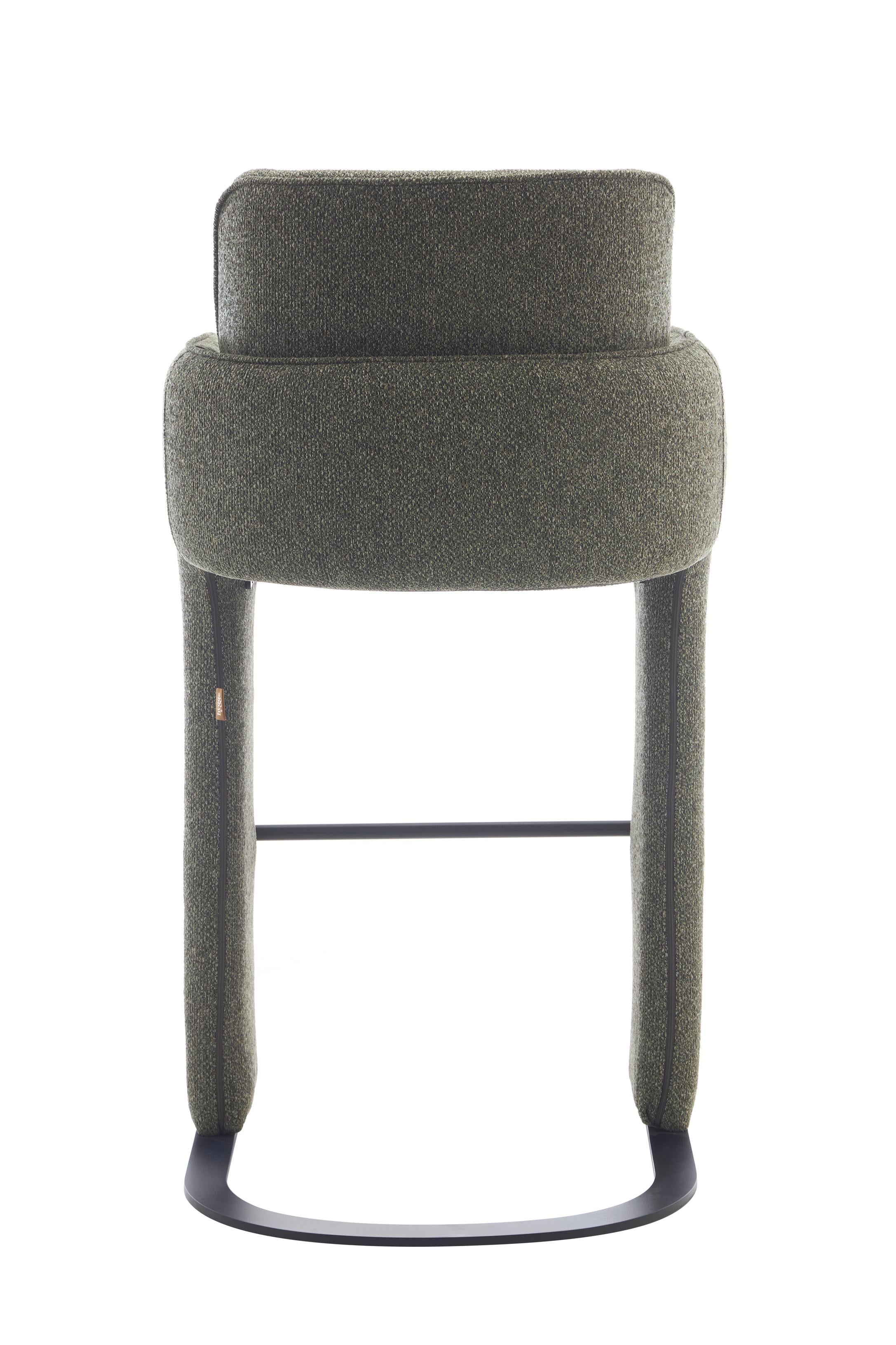 Elina counter stool wrapped in green upholstery, high-density cushioning, built from strong metal and plywood, and upholstered in 100% polyester fabric