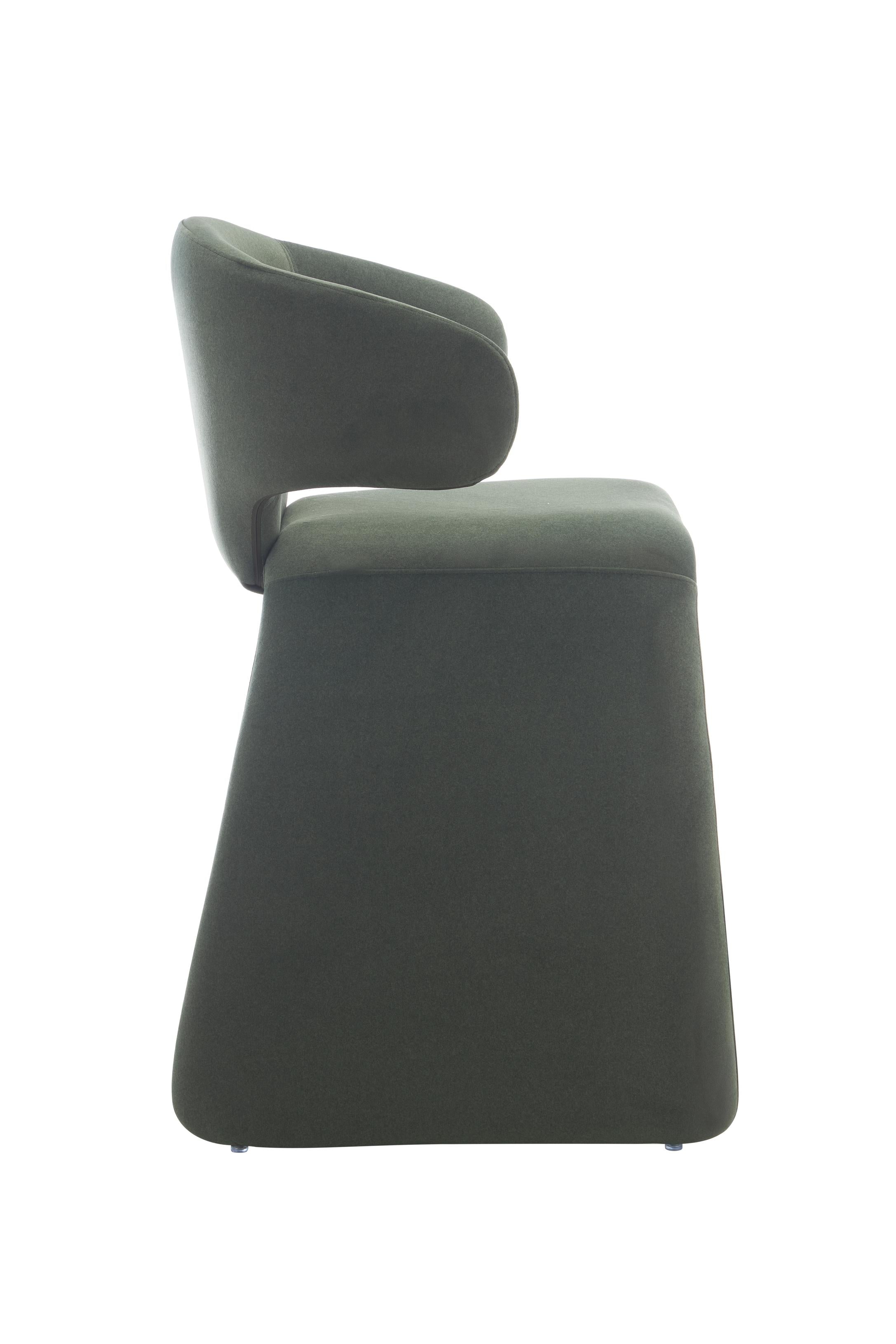 rounded silhouette, fully upholstered seat, and supportive curved back. The sturdy metal frame and plywood reinforcement ensure long-lasting durability, while the soft polyester fabric adds a beautifully textured finish.