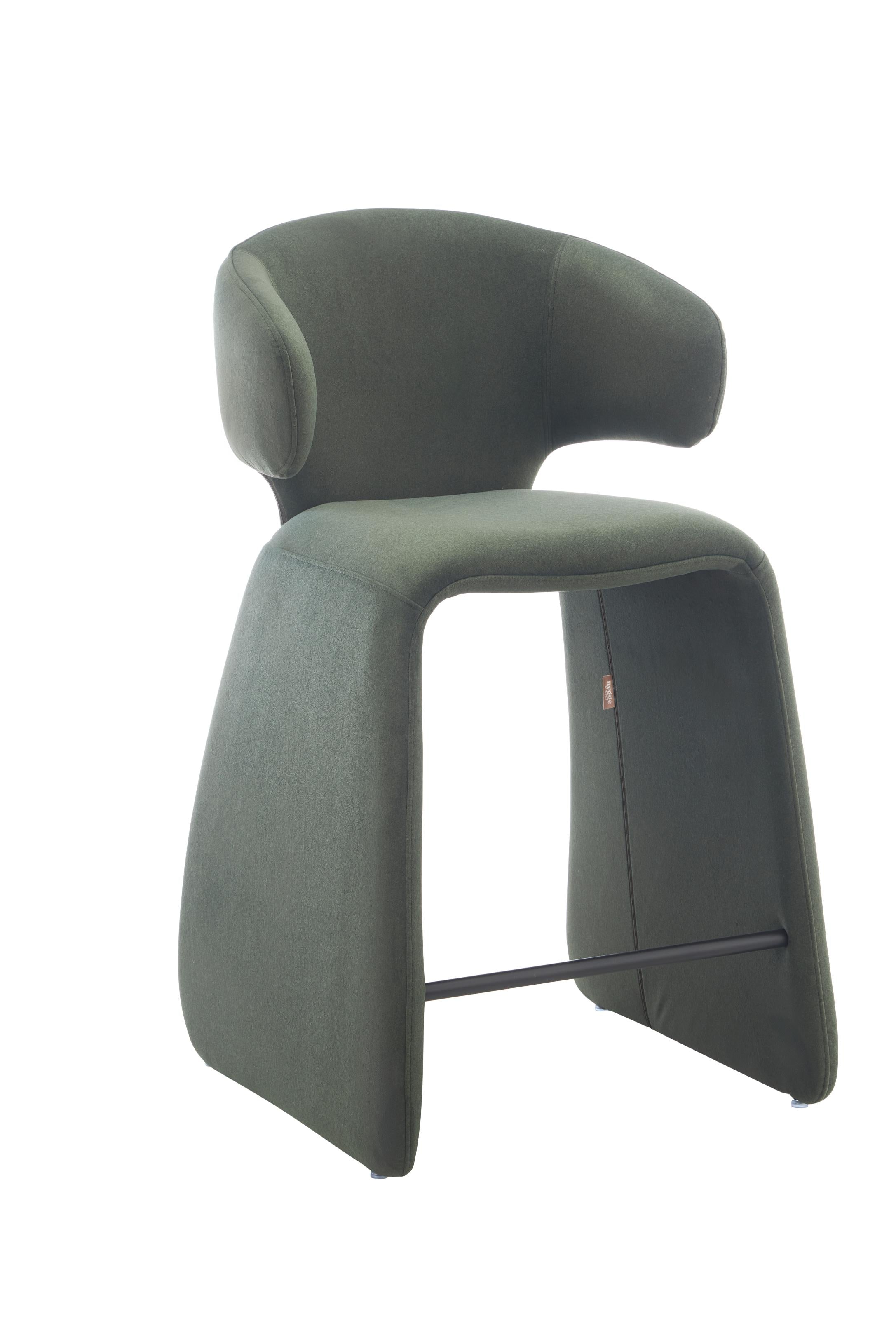 rounded silhouette, fully upholstered seat, and supportive curved back. The sturdy metal frame and plywood reinforcement ensure long-lasting durability, while the soft polyester fabric adds a beautifully textured finish.