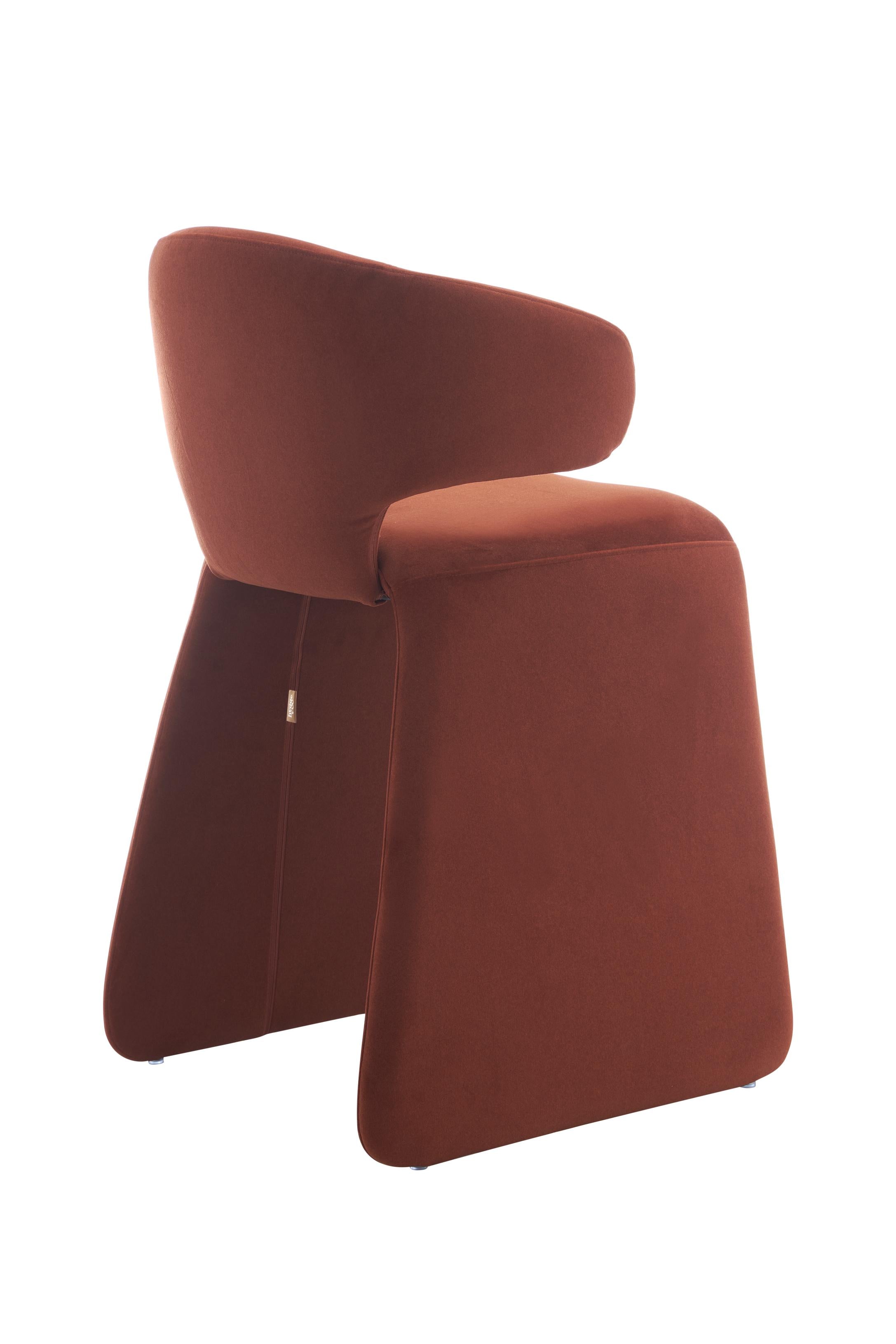 rounded silhouette, fully upholstered seat, and supportive curved back. The sturdy metal frame and plywood reinforcement ensure long-lasting durability, while the soft polyester fabric adds a beautifully textured finish.