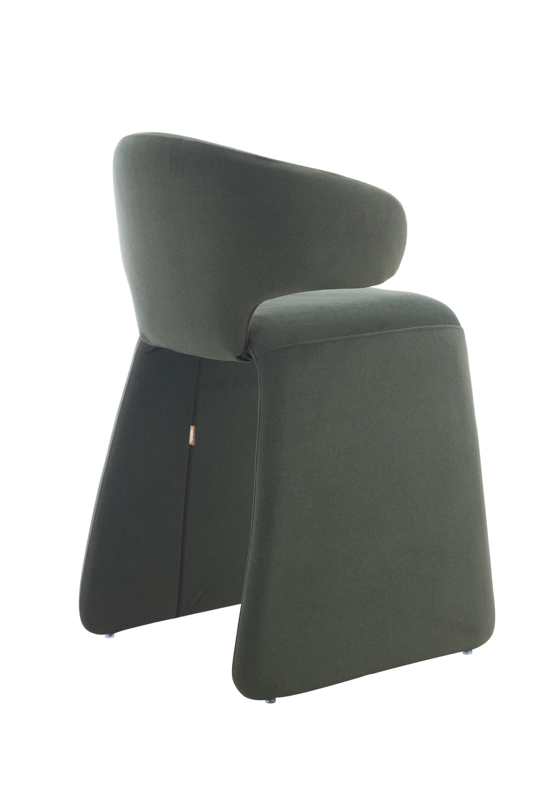 rounded silhouette, fully upholstered seat, and supportive curved back. The sturdy metal frame and plywood reinforcement ensure long-lasting durability, while the soft polyester fabric adds a beautifully textured finish.