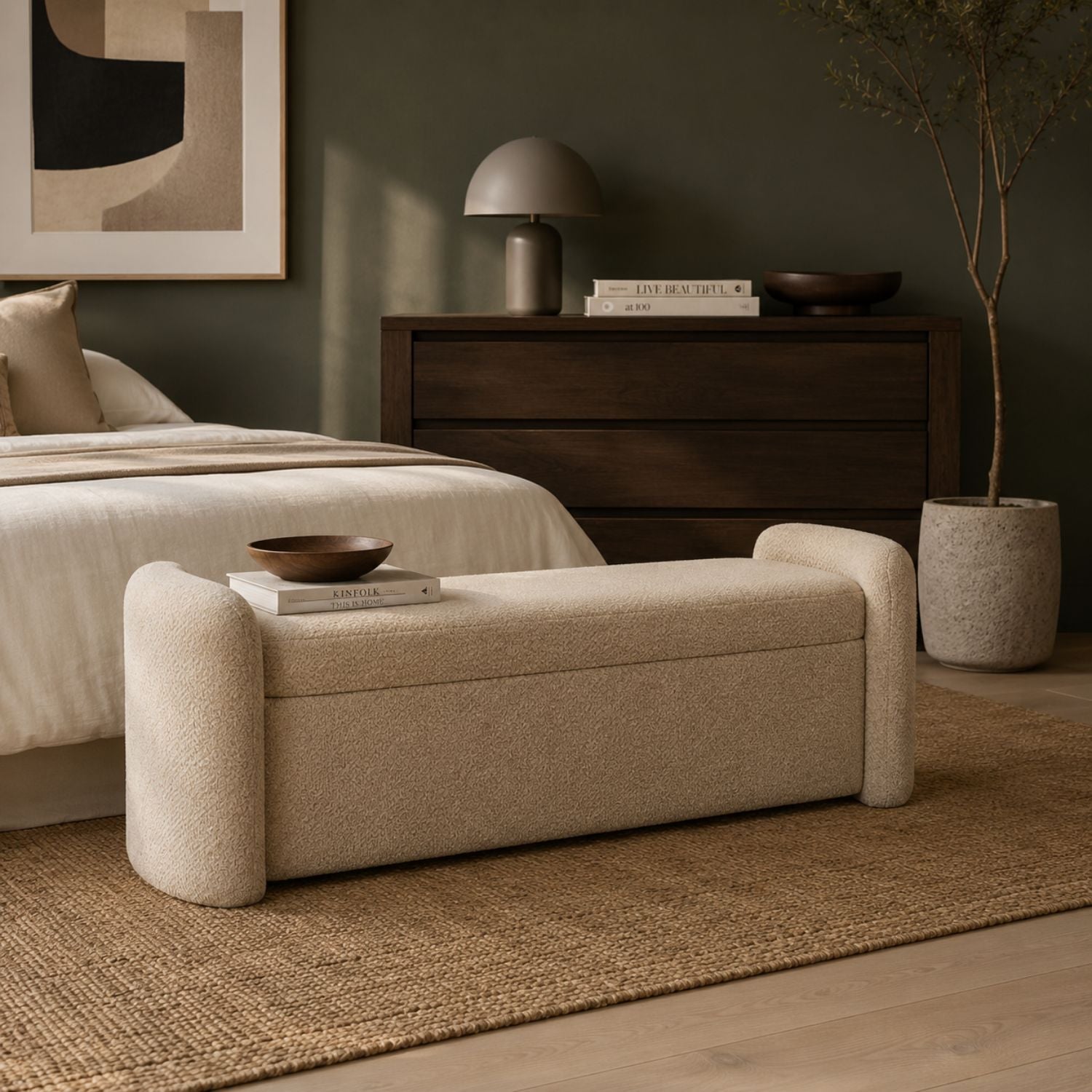 Front view of the Baenk upholstered bench featuring a cream textured fabric and soft rounded armrests