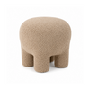 Front view of the Moin upholstered ottoman in taupe curly bouclé featuring a playful four-legged sculptural silhouette