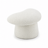 Front three-quarter view of the Muuto stool featuring a whimsical mushroom-shaped silhouette and white bouclé fabric