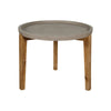 Front view of a small round patio garden table featuring a textured brown stone top and three tapered natural wood legs