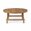 Front view of the Rosie round coffee table featuring a medium brown wood finish and a sturdy trestle-style base