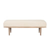 Front view of the Shae bench featuring a plush oatmeal-colored upholstered seat and a tapered brown wood frame