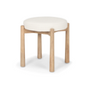 Front three-quarter view of the Shaiden stool featuring a light brown wood frame and a circular cream upholstered seat