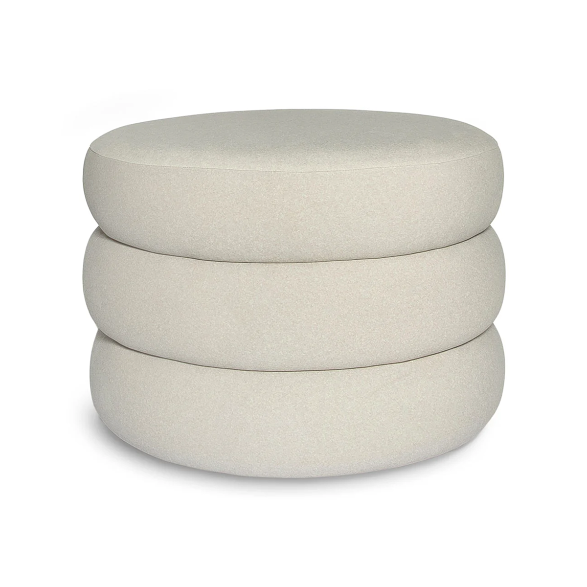 Front view of the Siel round ottoman featuring a unique triple-stacked design upholstered in soft sand-colored velvet