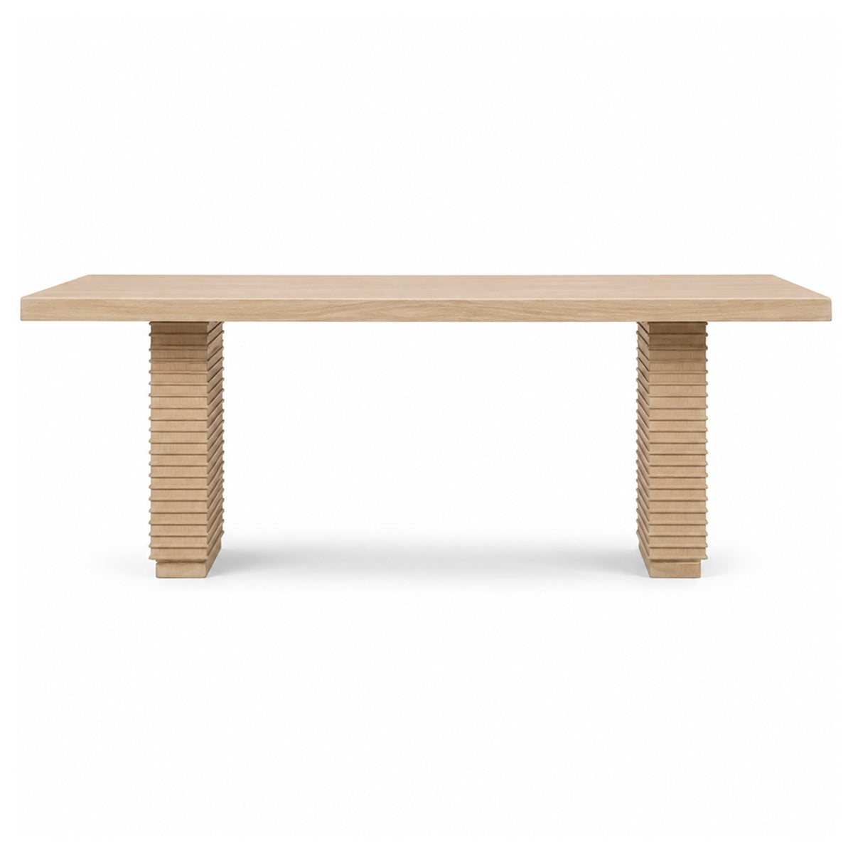 A light natural wood dining table with a rectangular top and two sculptural column bases made of stacked wooden slats, shown against a plain white background.