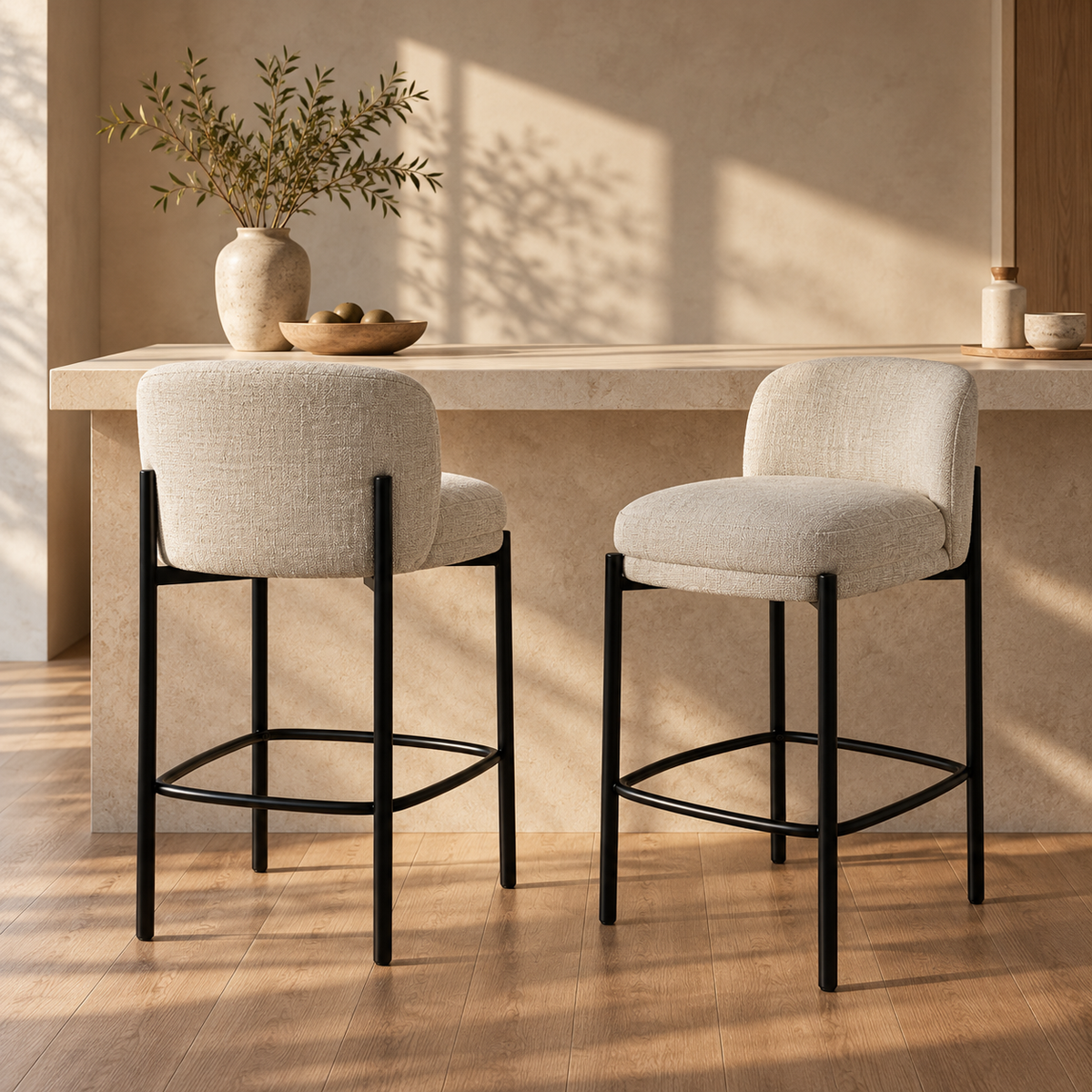 Front view of the Sorte counter stool in black textured fabric with a minimalist black metal frame
