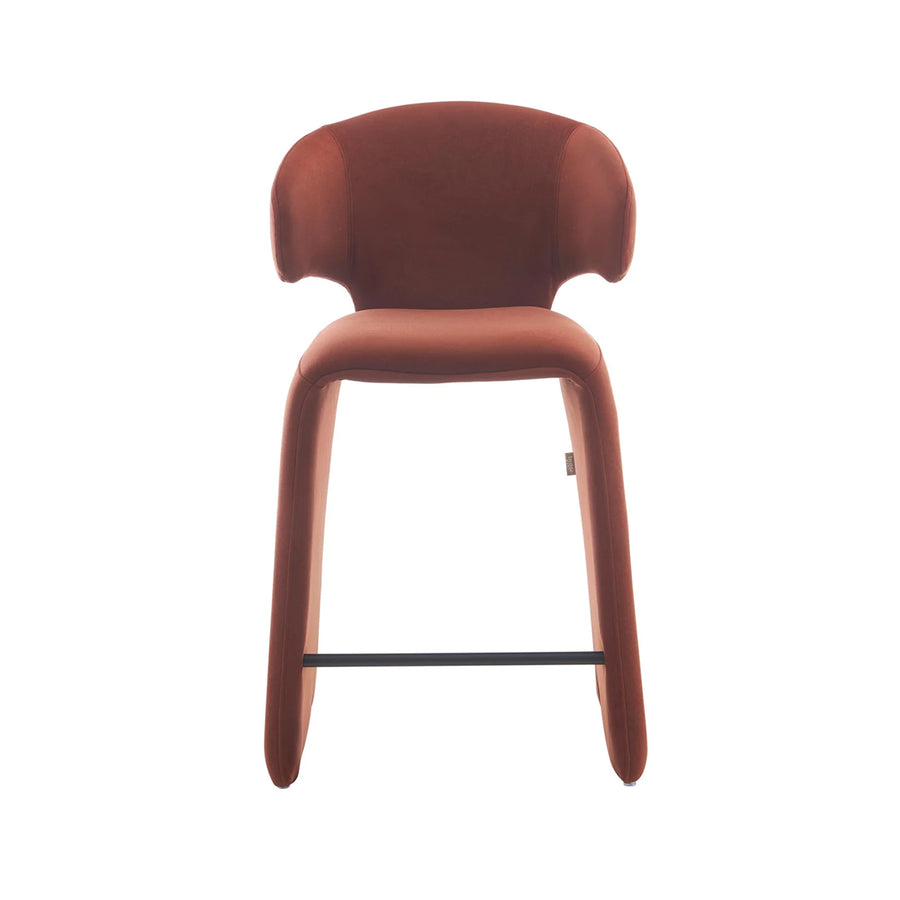 rounded silhouette, fully upholstered seat, and supportive curved back. The sturdy metal frame and plywood reinforcement ensure long-lasting durability, while the soft polyester fabric adds a beautifully textured finish.