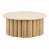 Front view of the Thandi coffee table featuring a circular cream stone top and a natural fluted wood pedestal base