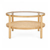 Front view of the Weslyn coffee table featuring a circular glass top and a natural woven cane lower storage shelf