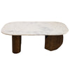Perspective shot highlighting the smooth oval marble surface and the unique architectural arrangement of the dark wood pedestal base