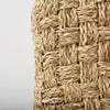Detailed side-profile macro shot highlighting the depth and tactile quality of the woven seagrass surface