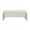 Front view of the Aero storage bench featuring cream textured upholstery and four tapered natural wood legs in a minimalist pill-shaped design