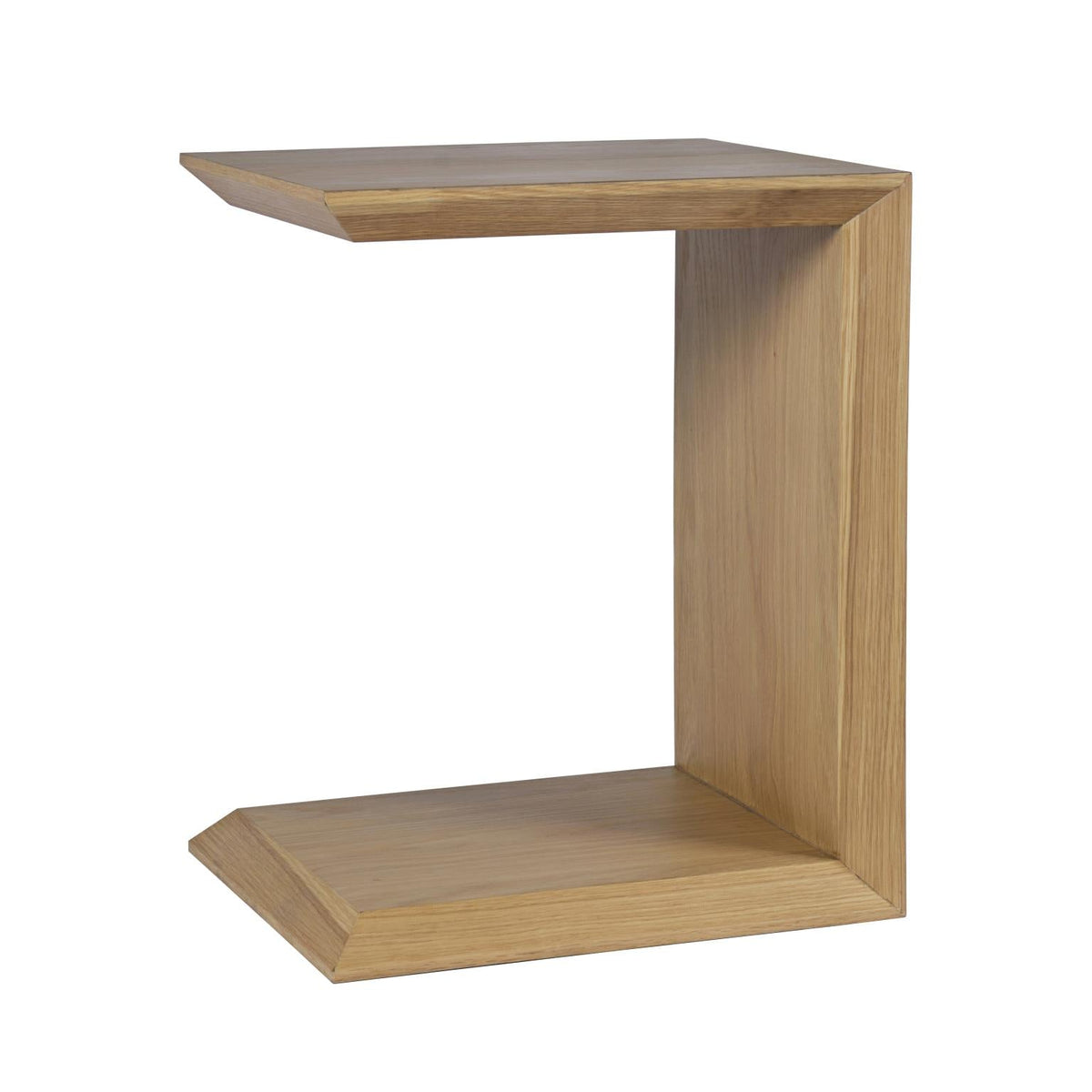 Perspective shot highlighting the architectural silhouette and the functional open base designed to slide under a sofa or chair