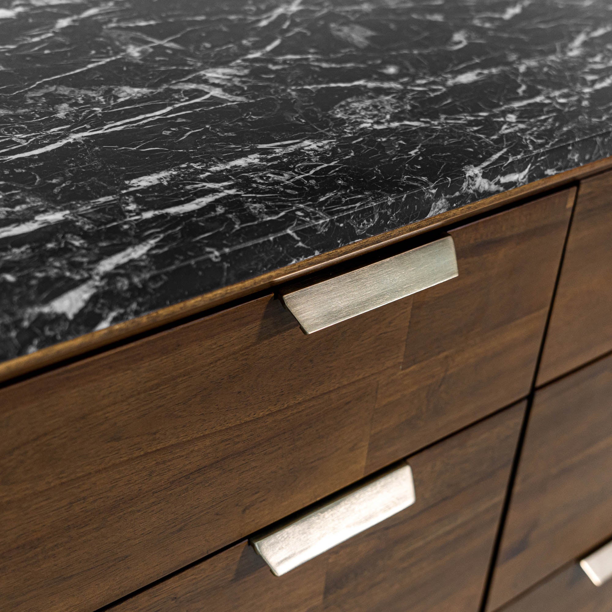 Front view of the Allure 6-drawer dresser featuring a rich walnut wood finish and a striking black faux marble top surface