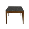 Side-angle view highlighting the tapered walnut legs and the integrated marble top construction