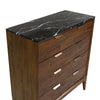 Deep perspective view emphasizing the compact vertical footprint of the 4-drawer chest in a gallery setting