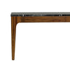 Detailed shot of the slim tapered walnut leg and the smooth finish of the table frame