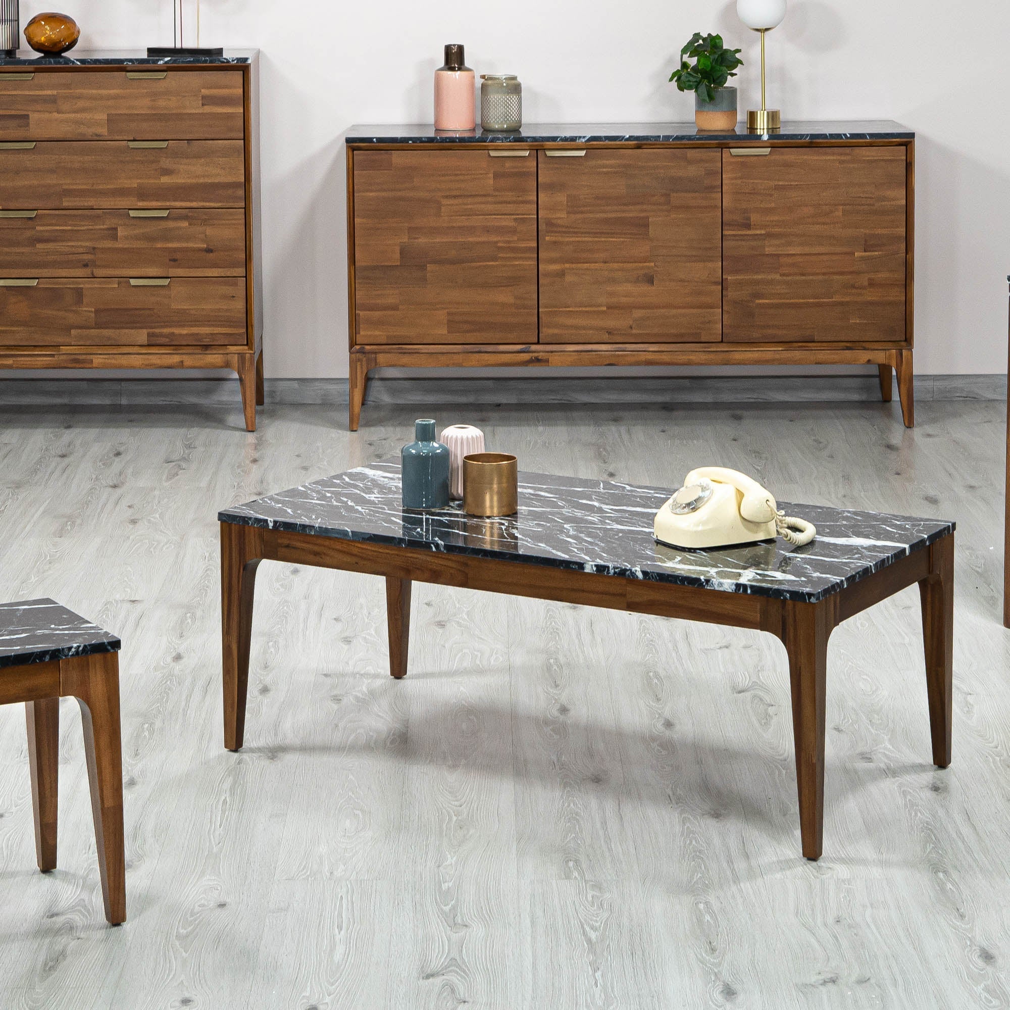 Front view of the Allure coffee table featuring a rectangular black marble top with white veining inset in a rich walnut wood frame