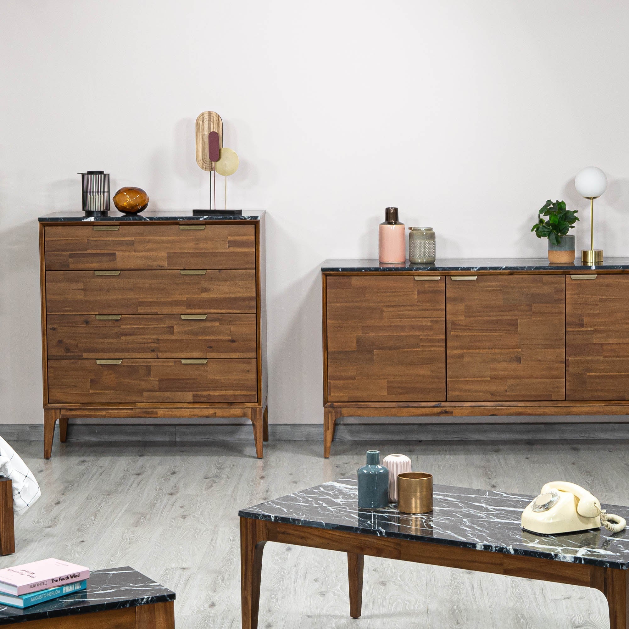 Front view of the Allure 4-drawer vertical chest featuring a rich walnut wood finish and a striking black faux marble top surface