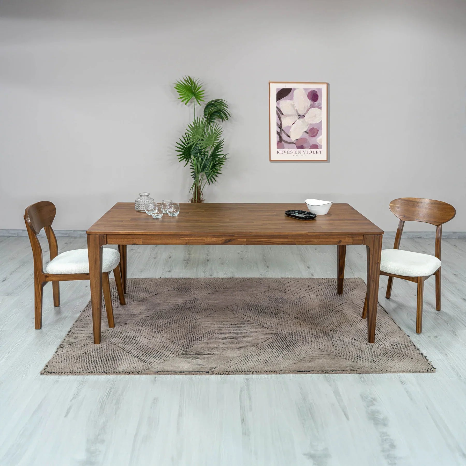Front view of the Allure dining table in a rich walnut-toned acacia wood featuring a minimalist rectangular top and flared tapered legs