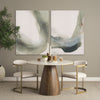 Studio lifestyle shot featuring the white marble dining table styled with contemporary chairs in a bright, minimalist room