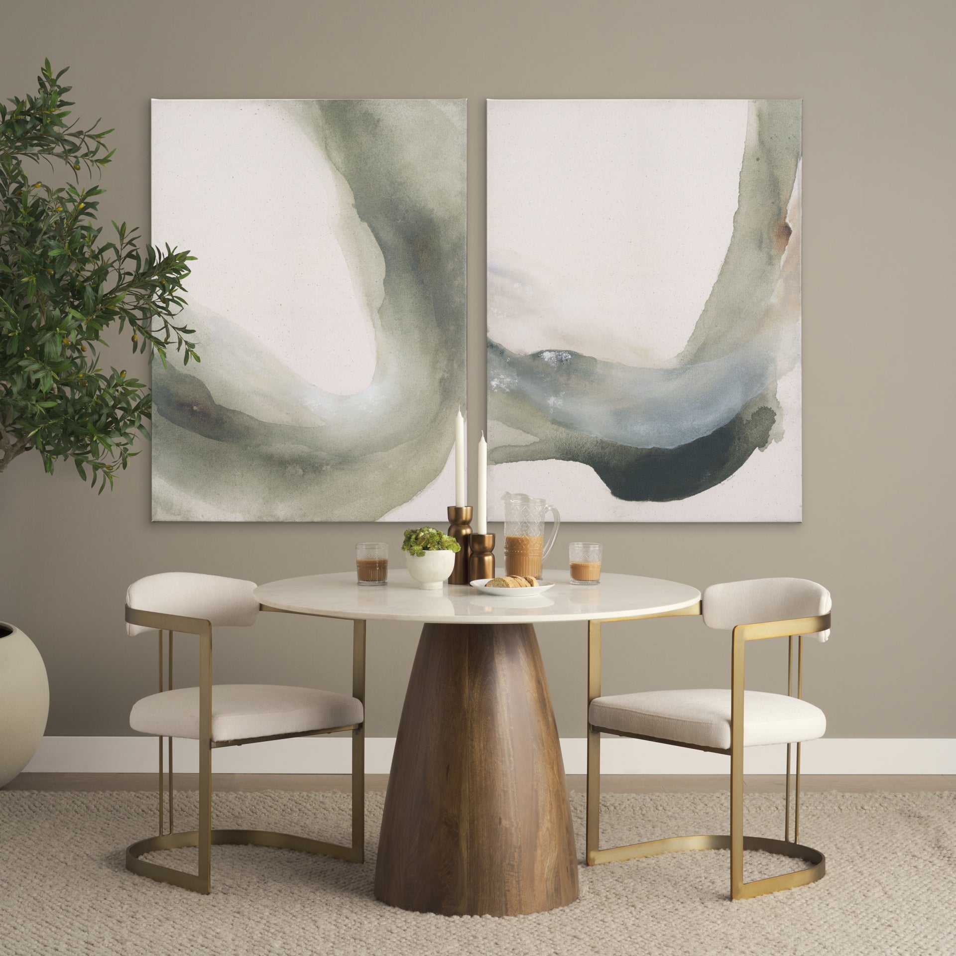 Front view of the Allyson round dining table featuring a white marble top and a solid mango wood tapered pedestal base