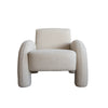 Front view of the Alva Accent Chair in cream bouclé with distinctive oversized tubular legs and a sculptural silhouette