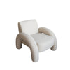 Elevated angled view highlighting the architectural flow of the upholstered legs into the backrest